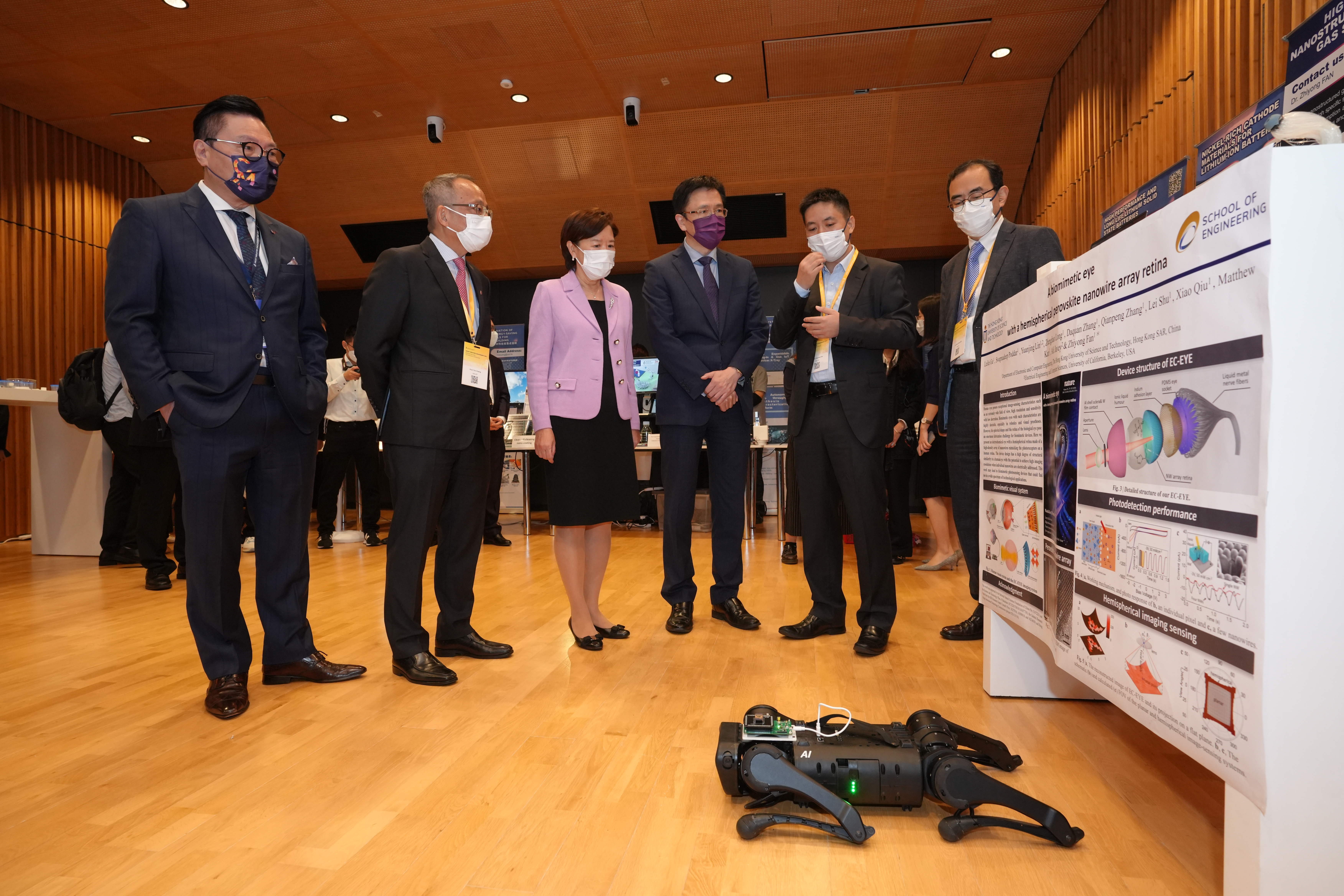 HKUST researchers introduce their research projects to Prof. SUN Dong, Secretary for Innovation, Technology and Industry of the Hong Kong Special Administrative Region (HKSAR) (third right), Prof. Nancy IP, HKUST President (third left), Prof. Tim CHENG, HKUST Vice-President for Research and Development (second left)