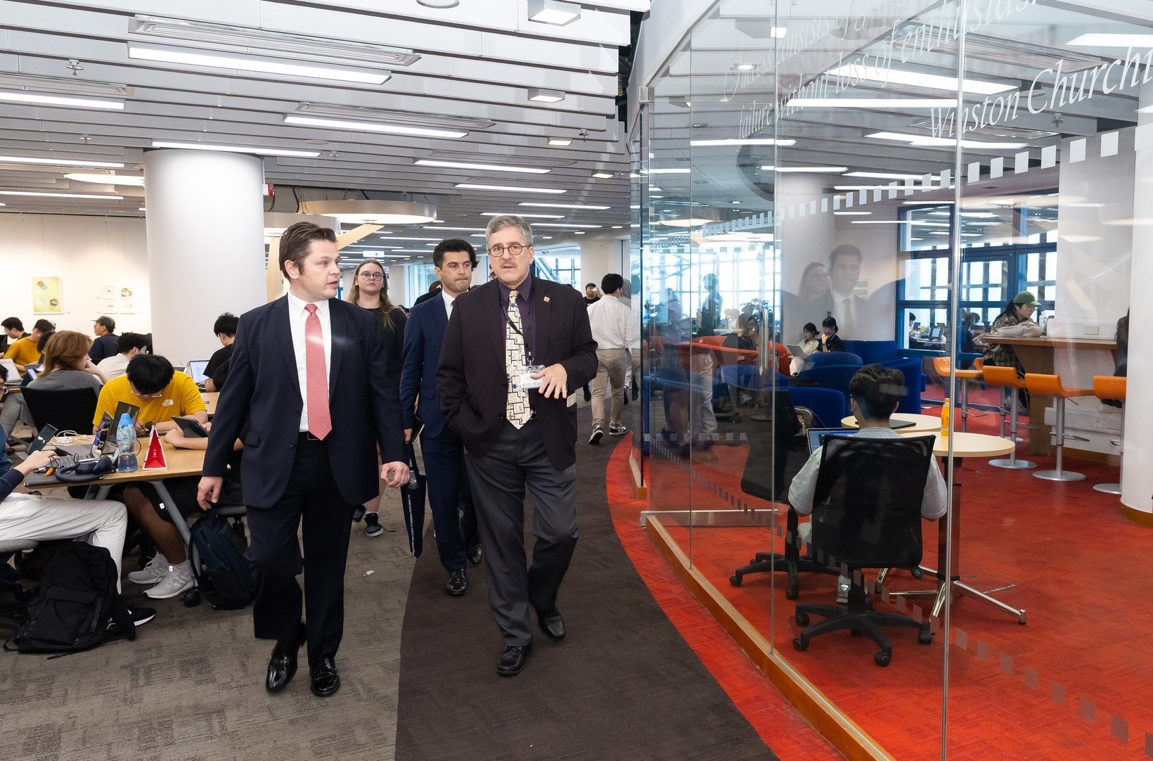 Consul General Evcin and his delegation tour the HKUST Lee Shau Kee Library.