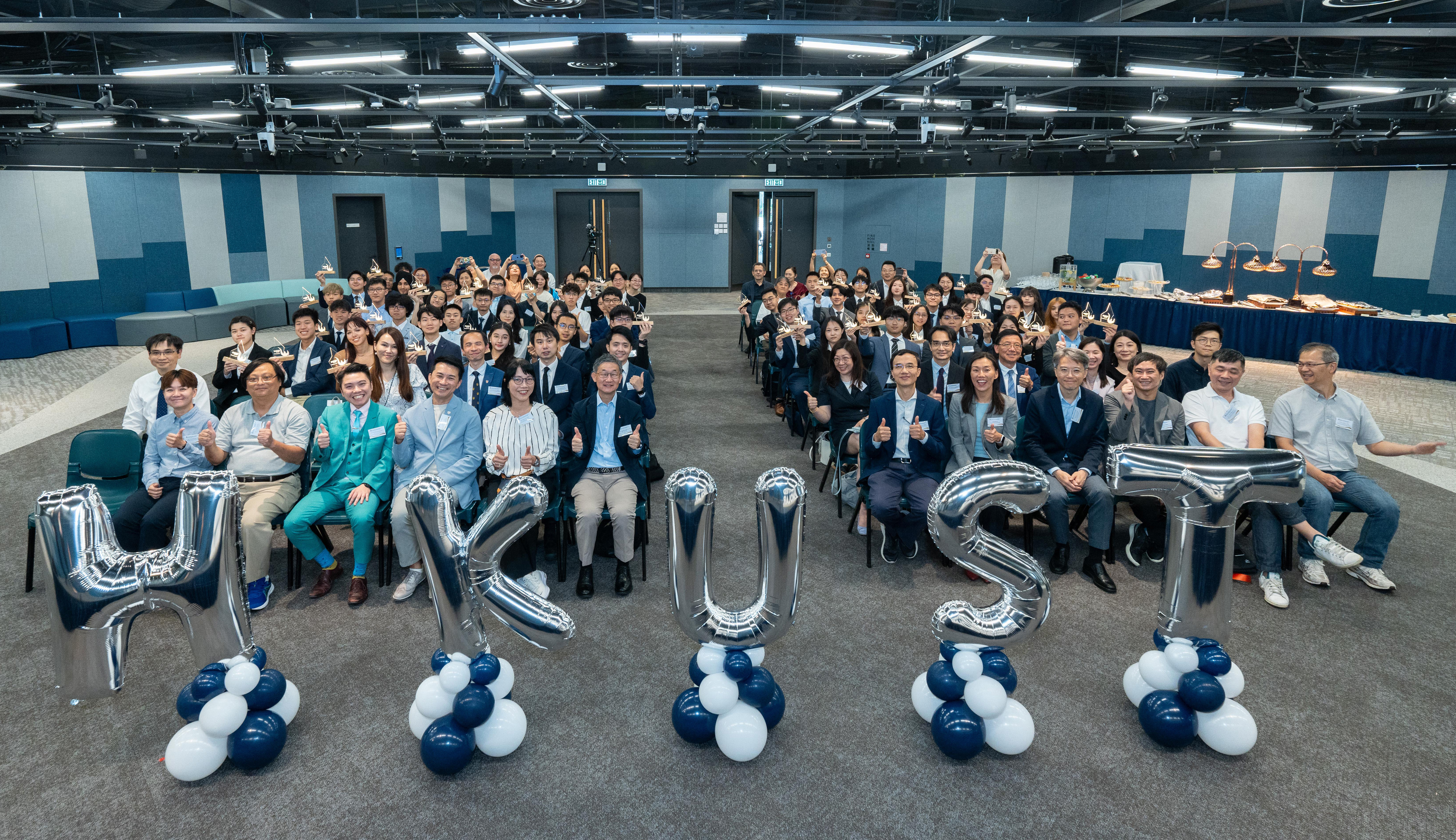 A group photo of over 60 students through the School Nominations Direct Admission Scheme (SNDAS) and the Student-Athlete Learning Support and Admission Scheme (SALSA), HKUST Associate Provost (Teaching & Learning) Prof. Jimmy FUNG (first row, sixth right), HKUST Undergraduate Recruitment & Admissions Director Prof. Emily NASON (first row, fifth right), secondary school principals, teachers as well as representatives from the Hong Kong Sports Institute and the Hong Kong, China Table Tennis Association.