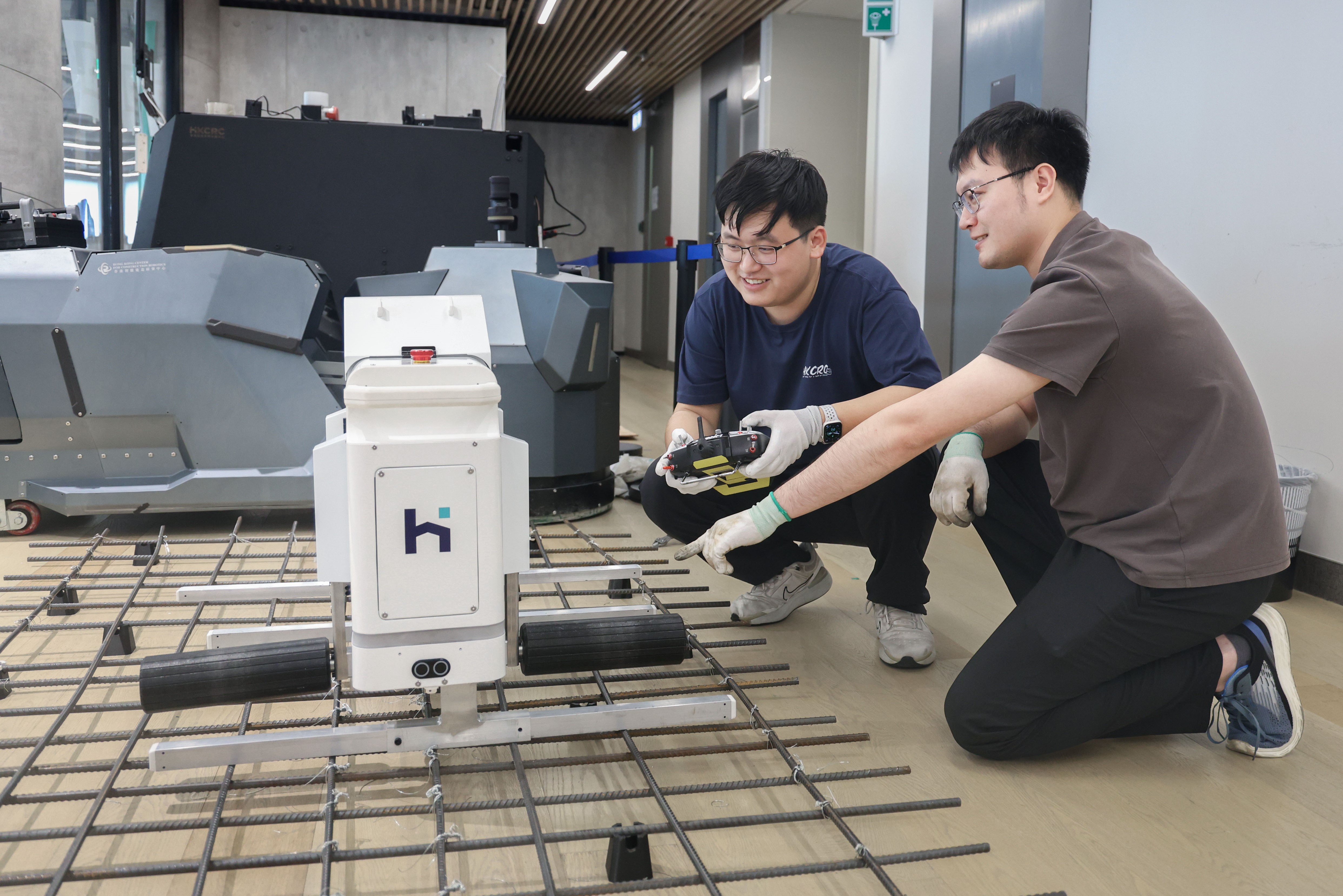 The rebar tying robot, a research project led by HKUST MPhil student LI Haozhen (left), was awarded a Gold Medal with Congratulations of the Jury at the 49th International Exhibition of Inventions Geneva.