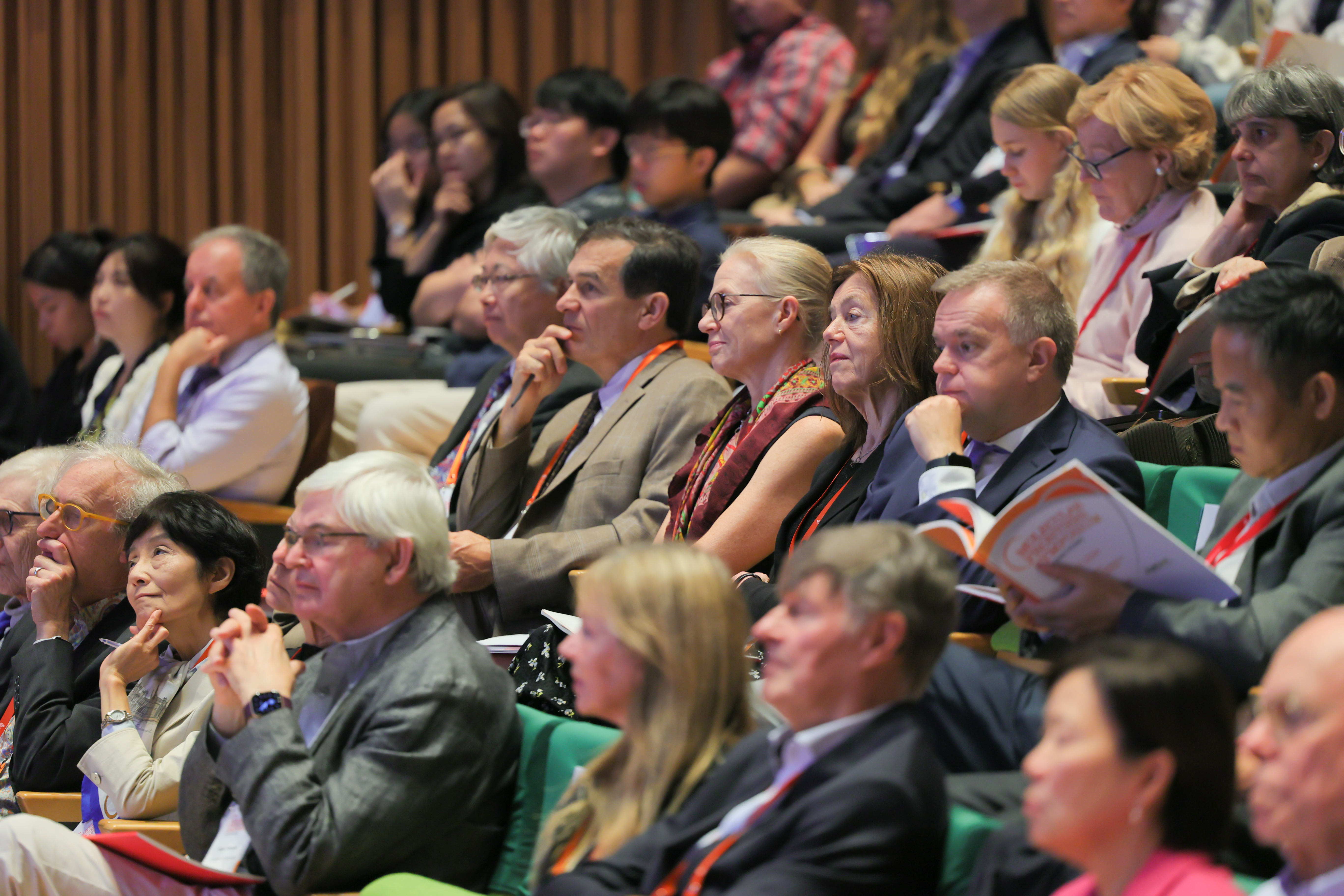 A captivated audience listens to leading scientists at the symposium.