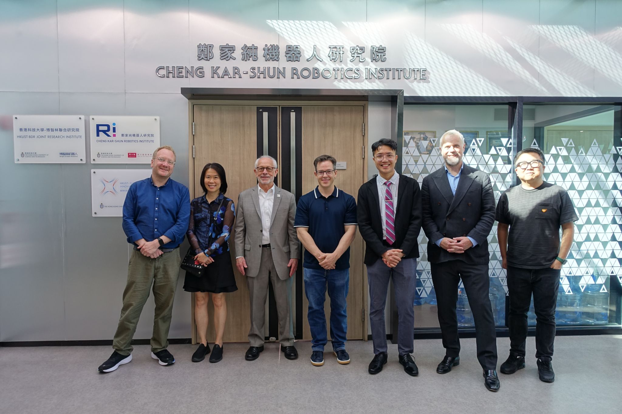 The Cornell University delegation tours the Cheng Kar-Shun Robotics Institute.