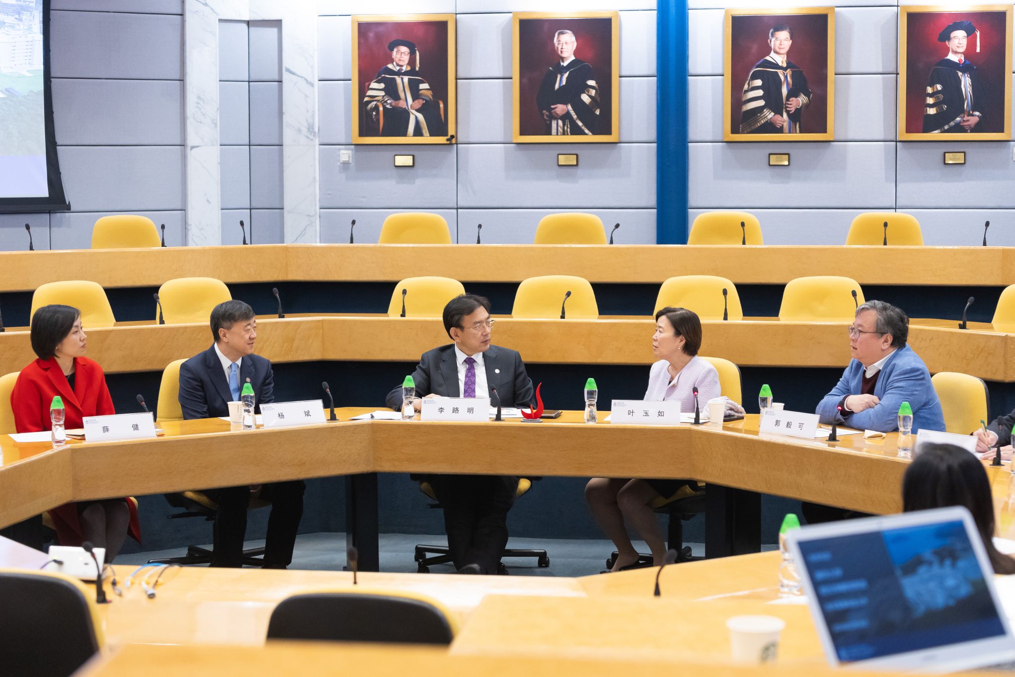 HKUST leadership engages in a meeting with the Tsinghua University delegation.