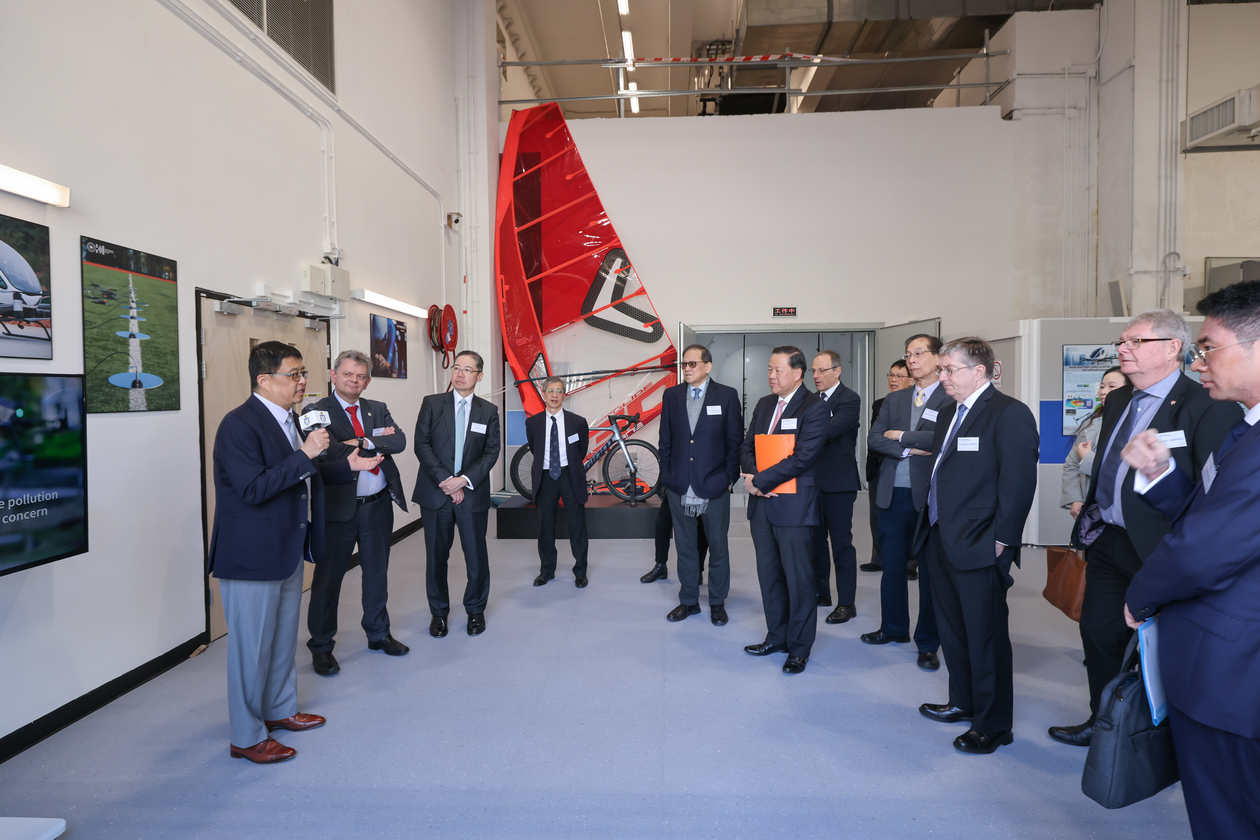 Prof. ZHANG Xin (first left), Director of the Aerodynamics and Acoustics Facility highlights the team’s significant contributions to the development of the low altitude economy through innovative applications in noise reduction and flight safety assessment and the enhancement of performance of elite athletes. 