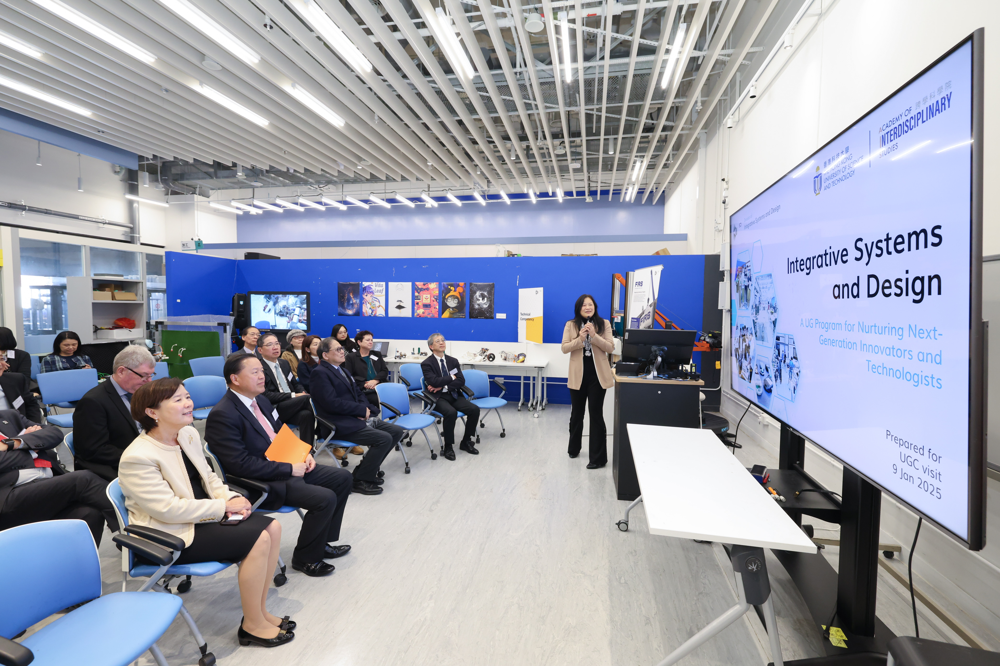 Prof. ZHANG Qian (first right), Acting Head of the Division of Integrative Systems and Design showcases the prototyping tools at the makerspace ‘ISDworks!’. 