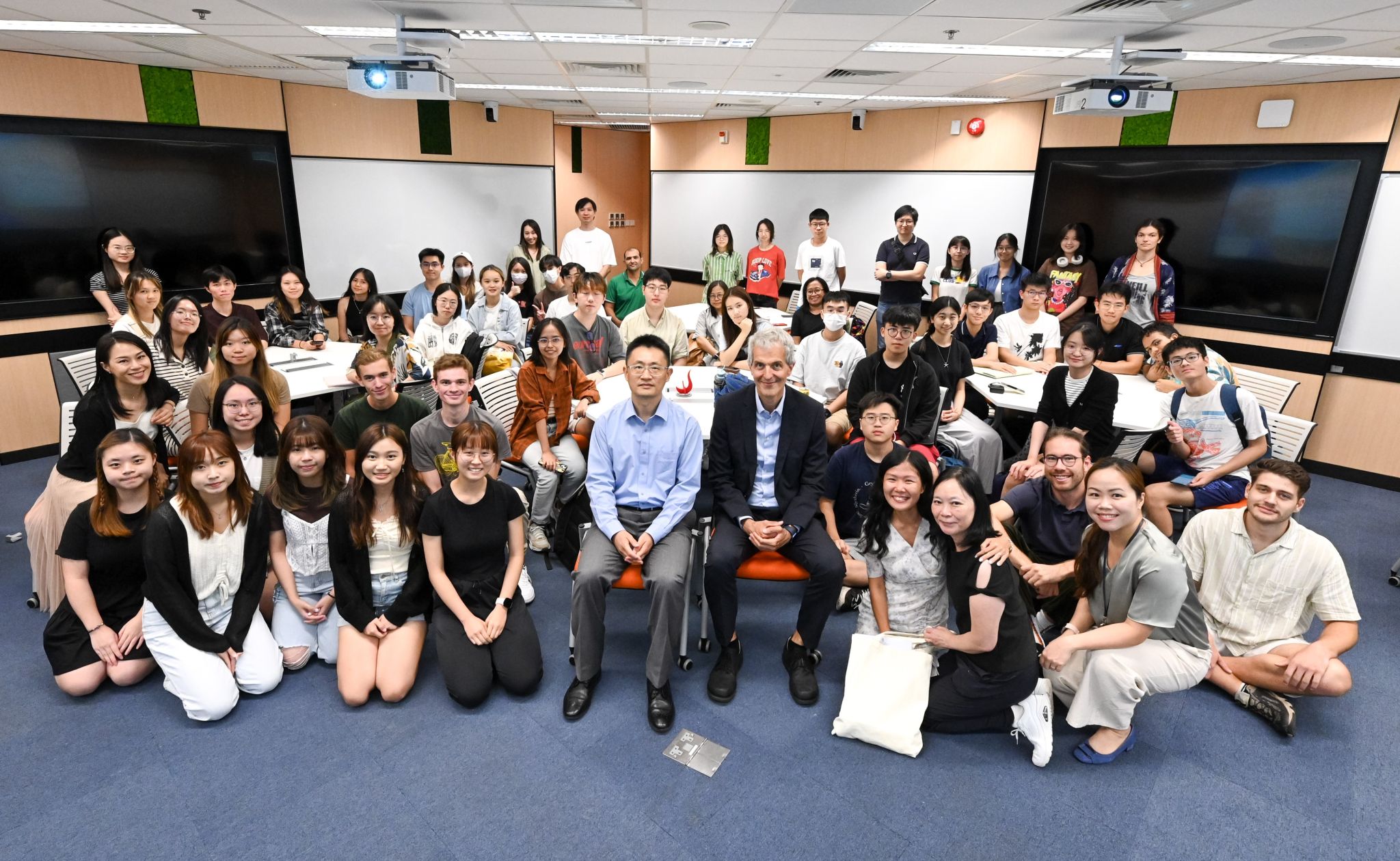 Consul General Mr. Stefan BREDOHL engages in discussion with over 60 students after his sharing session.