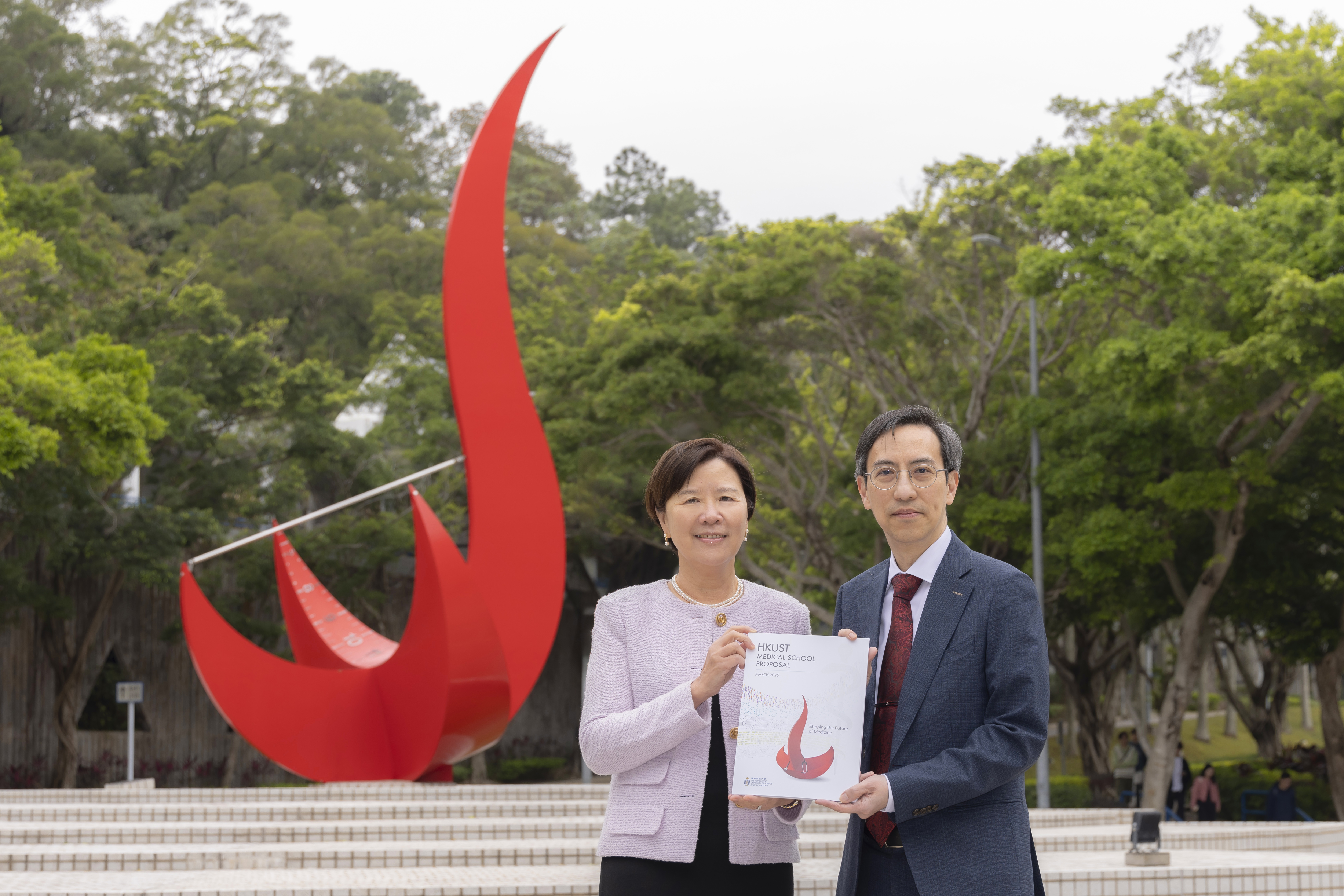 HKUST President Prof. Nancy IP and Dean of Science Prof. WONG Yung-Hou display the formal proposal 