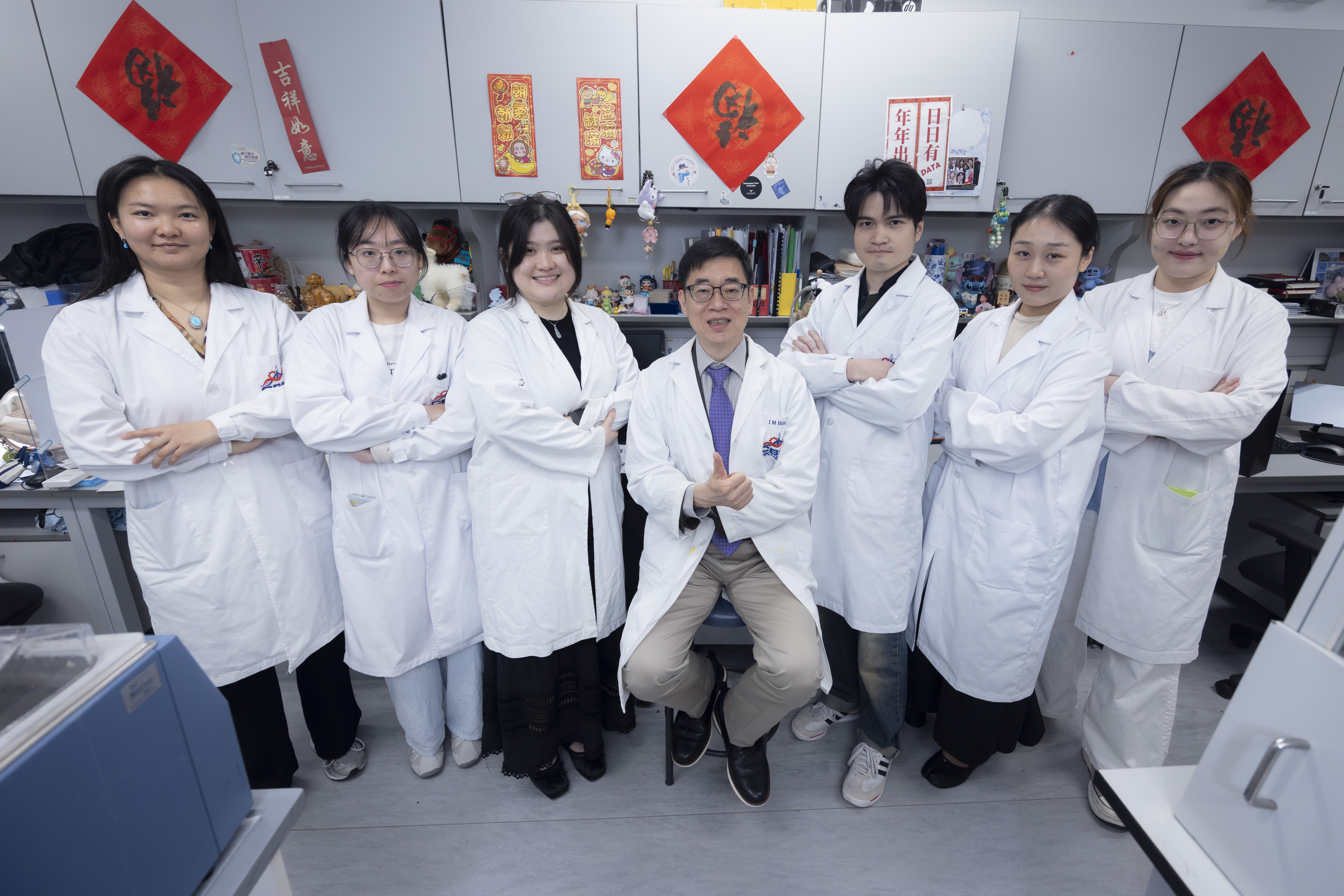 The research by Prof. Hsing (center) and his HKUST research team presents the first-ever DNA-guided, RNA-targeting CRISPR system.