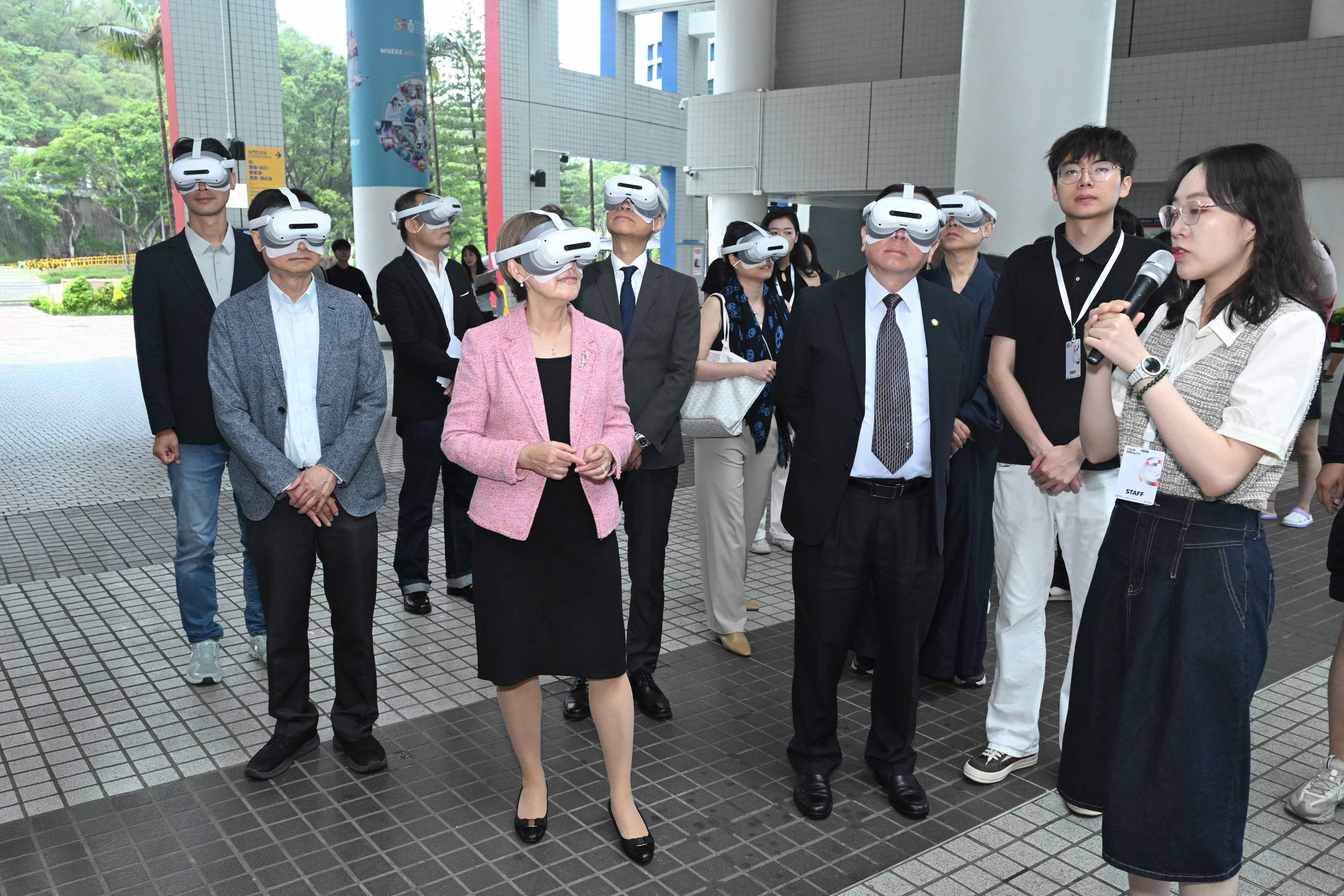Guests don headsets to explore MR artworks around the Clear Water Bay campus.