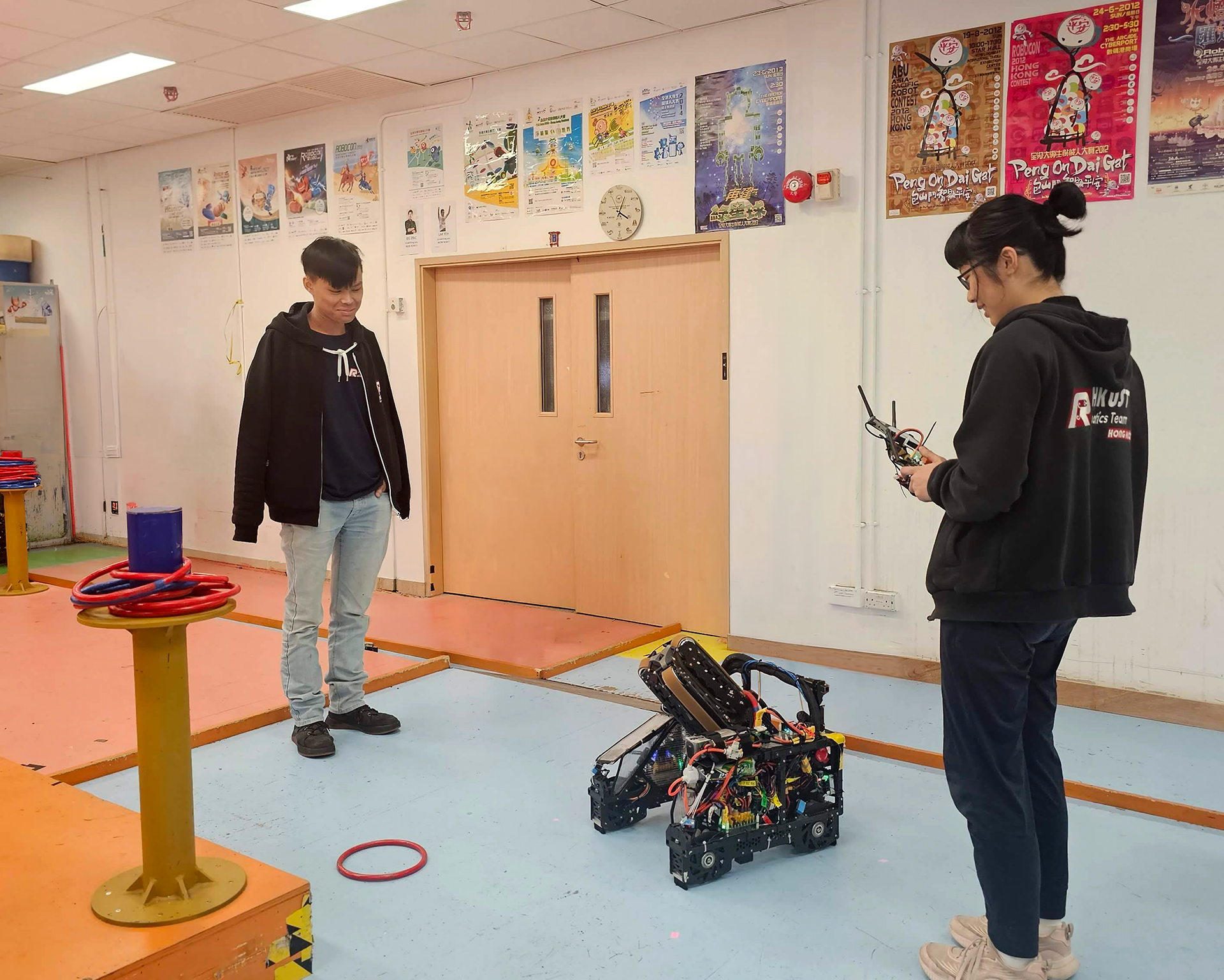 Student engineers pilot their newly minted machine across custom test tracks inside the Dream Team Hub workspace, relentlessly refining their complex algorithmic coordination before match day.
