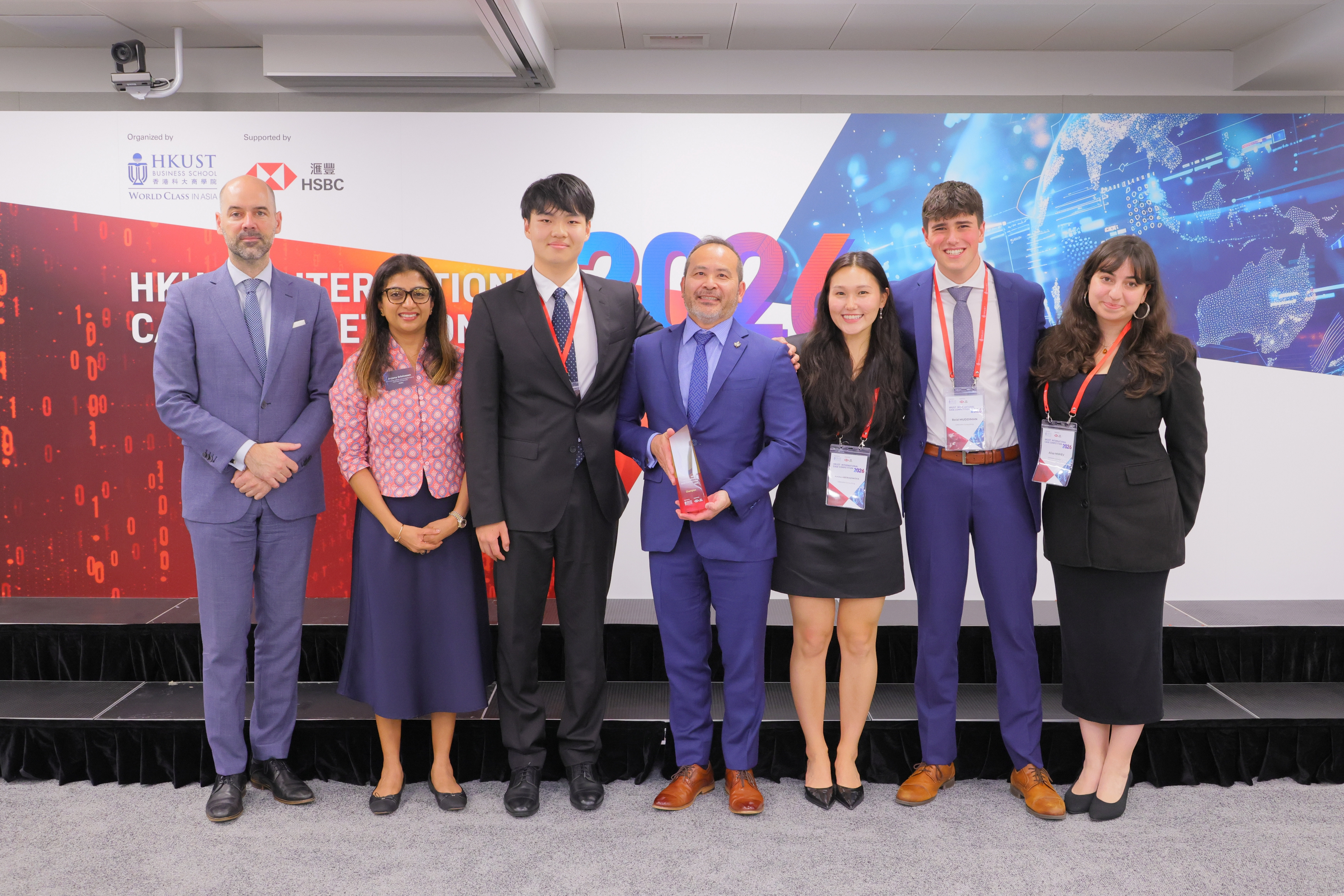 Prof. Frederik Anseel (far left), Dean of the School of Business and Management, and Ms. Anjana Srinivasan, Chief Administrative Officer Asia & Middle East & COO Asia International Markets at HSBC (second from left), celebrate with the team from the University of British Columbia Sauder School that won the 2026 International Case Competition. HSBC supported the event for the fourth consecutive year.