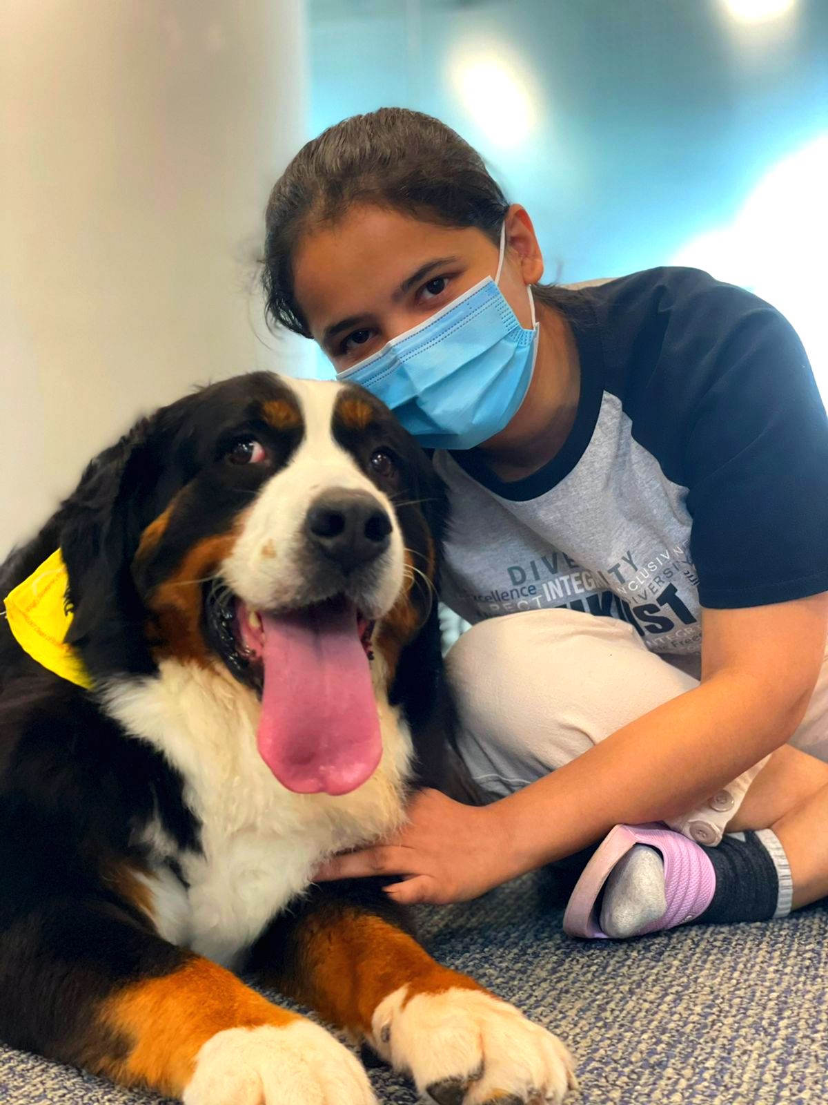 Aastha and a therapy dog