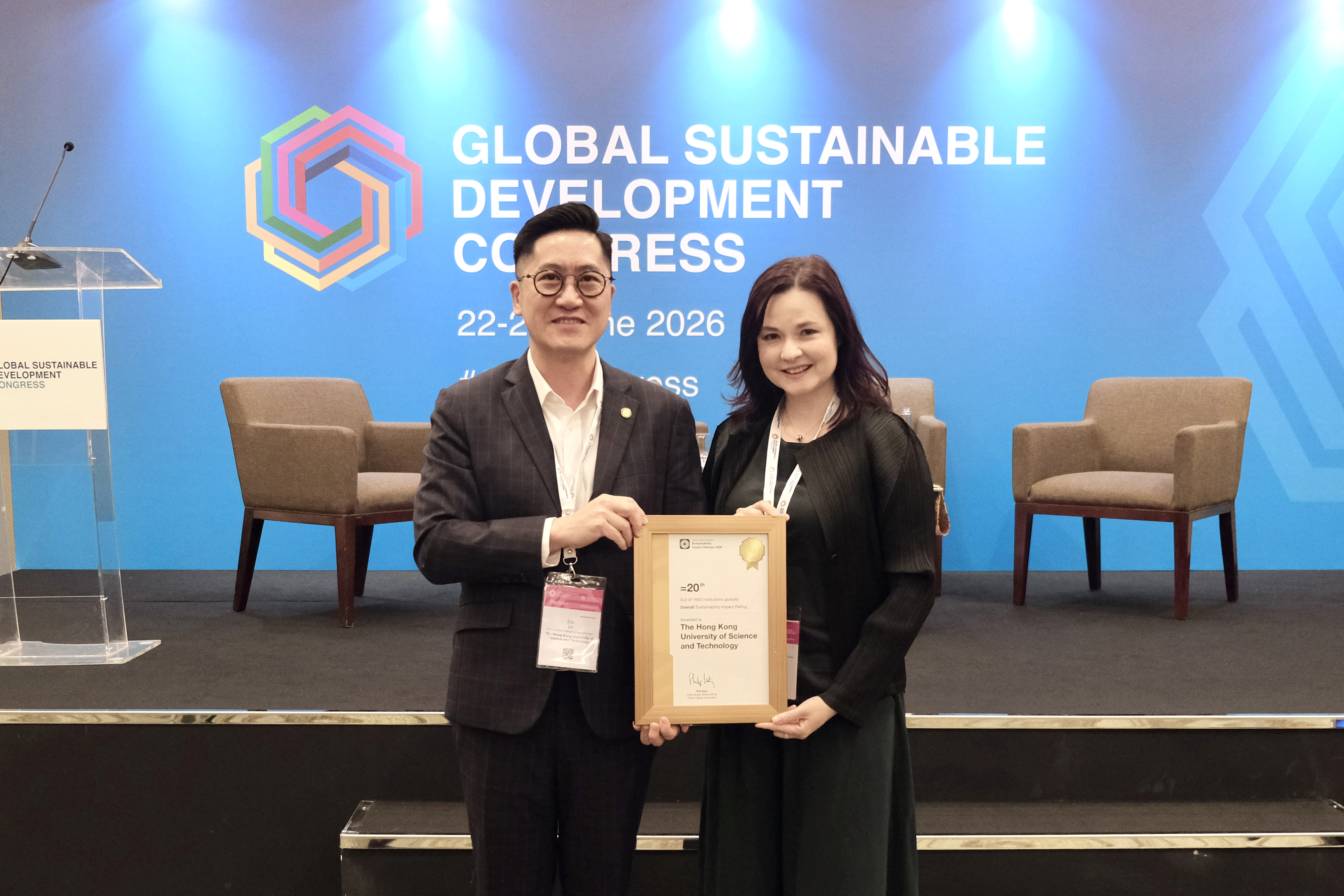 Dr. Alison Lloyd (right), Associate Provost (Institutional Data and Research), and Mr. Eric Lo (left), Head (Global Intelligence and Strategy), Office of Academic Strategy and Data Analytics, with the Times Higher Education Sustainability Impact Ratings 2026 certificate. The ranking recognizes HKUST's excellence in embedding sustainability into teaching, research, and collaboration with industry and the community.