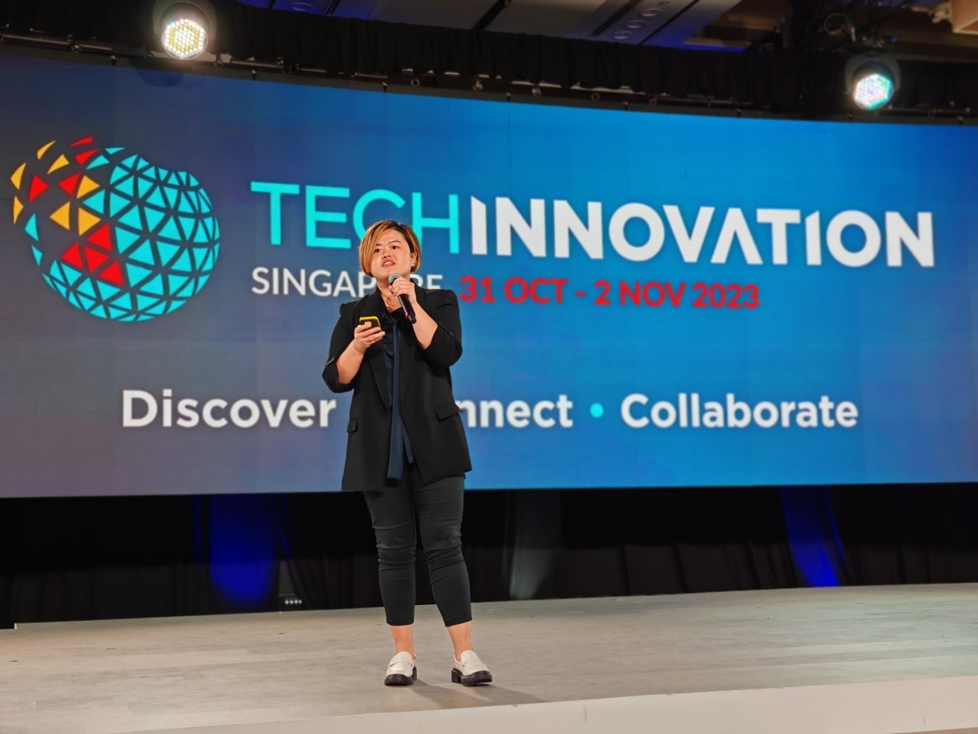 Melody at her presentation at 2023 Techinnovation in Singapore.