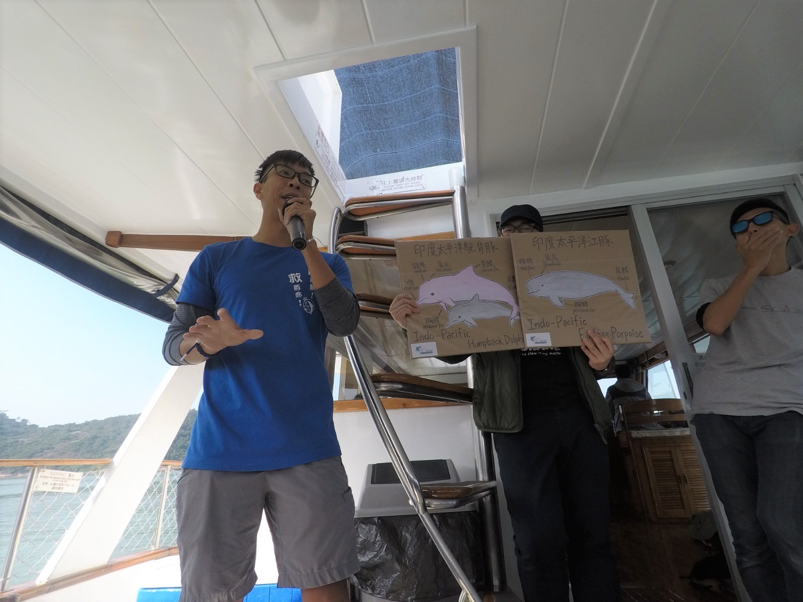 HKUST Biology graduate Taison Chang on a dolphin-watching boat trip