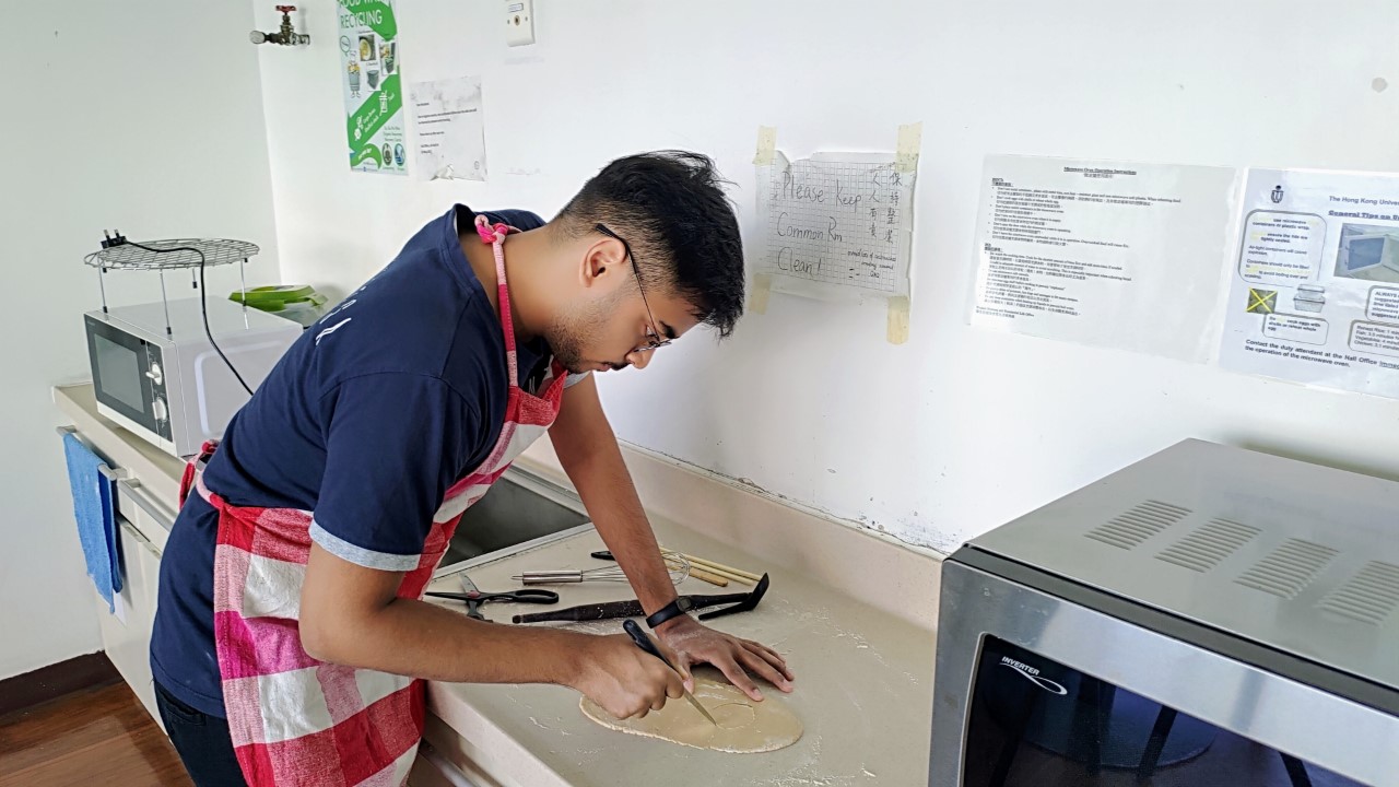Student baking cutlery