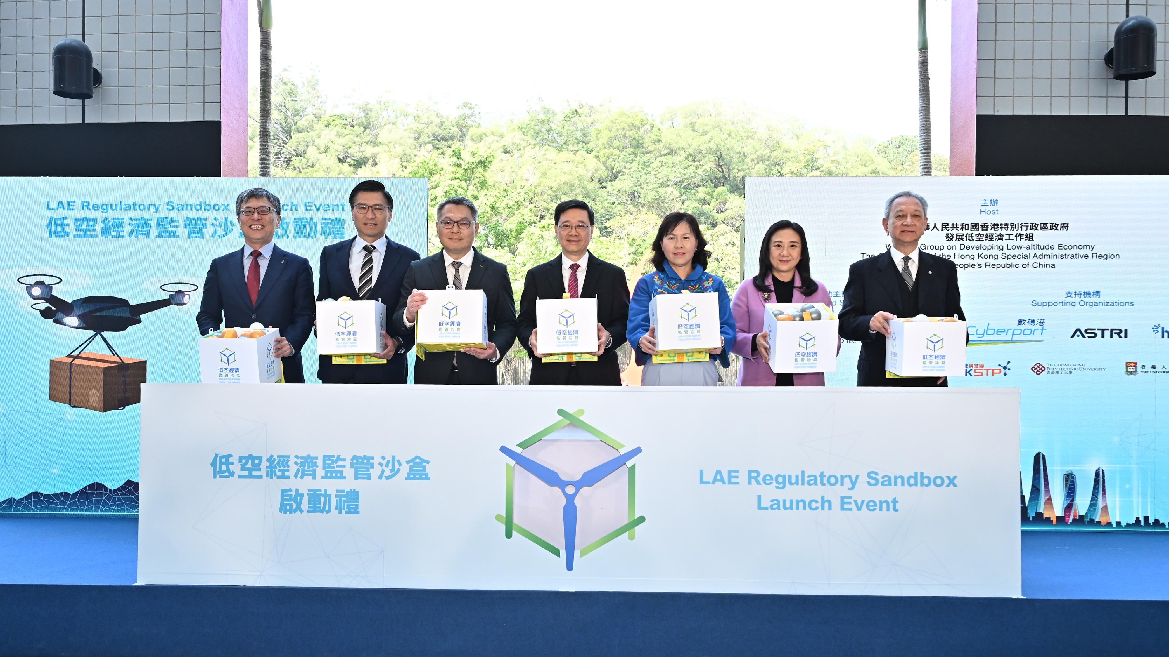 The Chief Executive, Mr. John LEE, attends the Low-altitude Economy Regulatory Sandbox - Launch Event today (March 20). Photo shows Mr. Lee (center); the Secretary for Transport and Logistics, Ms. Mable CHAN (third right); the Director-General of Civil Aviation, Mr Victor LIU (third left); the Council Chairman of the Hong Kong University of Science and Technology, Prof. Harry SHUM (first left), and other guests officiating at the ceremony. (ISD) 