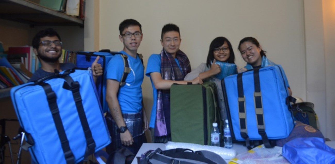 Melody (first right) and her team designed and created an innovative mobile drug dispensary box that enables staff of a Cambodian NGO to more effectively dispense medicines in the slums of Phnom Penh.