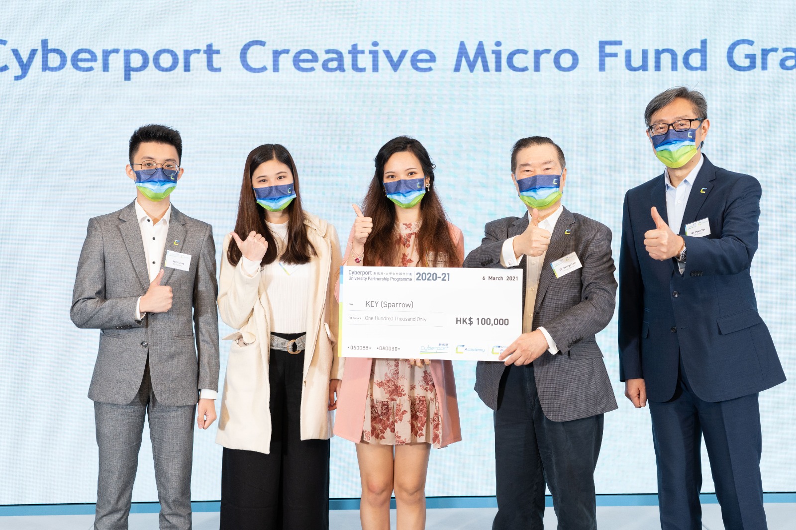 Kevin (first from the left) receiving a 100K-dollar funding check for his budgeting application "Sparrow" from Cyberport Creative Micro Fund.