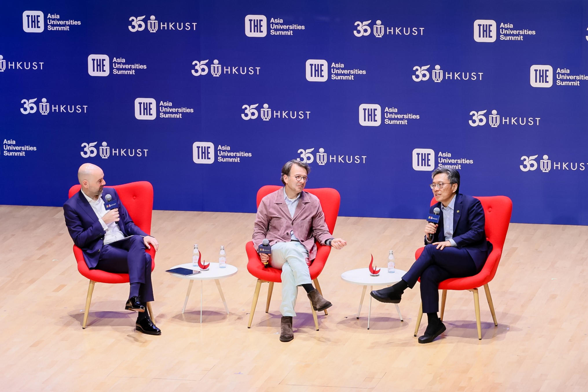 A fireside chat between Prof. Harry SHUM, Chairman of the HKUST Council (right), and Judson ALTHOFF, CEO of Microsoft's Commercial Business (middle), delves into the transformative power of AI across both industry and academia, discussing how universities can collaborate with global technology leaders to prepare students for an AI￼pervasive world. The session is moderated by Prof. Frederik ANSEEL, Dean of Business and Management of HKUST (left).