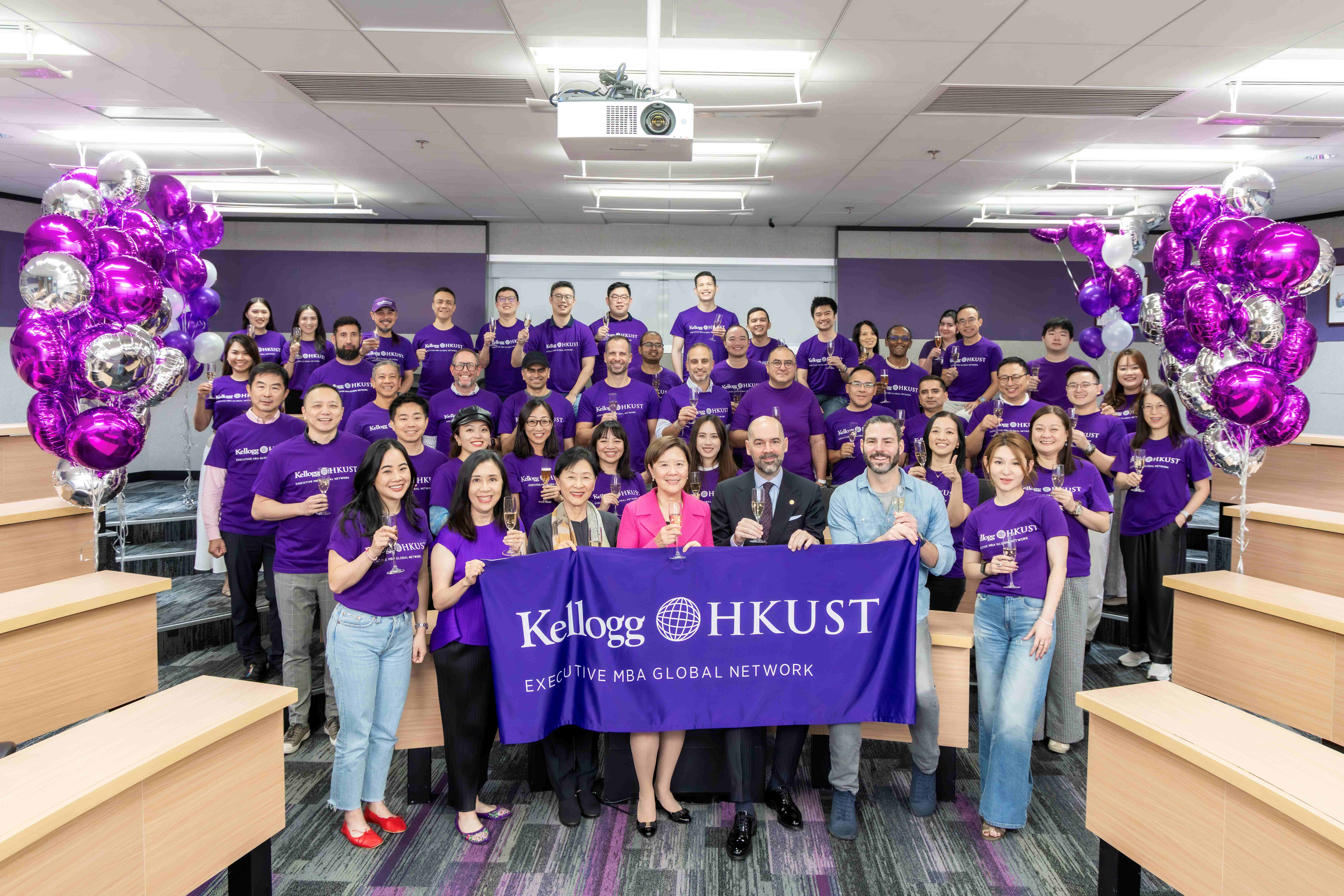 Prof. Nancy IP (front row, center), President of HKUST; Prof. Frederik ANSEEL (front row, third right), Dean of HKUST Business School; Ms Judy AU (front row, second left), Program Director of Kellogg-HKUST EMBA Program, and KH EMBA students celebrate the program’s record-extending 13th World No. 1 ranking. 