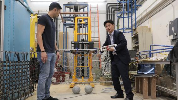 Prof. Charles Ng (right) and Dr. Choi explain how the newly-design multiple flexible barrier system work.