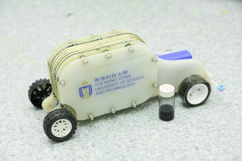 A demonstration vehicle with a bottle of the e-fuel.