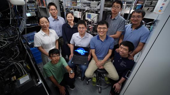 Prof. DU Shengwang (middle left, seated), Prof. LIU Junwei (middle right, seated), Prof. JO Gyu-Boong (back left, standing) and their research team 