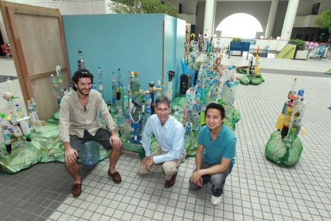 At the exhibit are (from left) artist Sebastian Pascot, Prof Paul Forster of the Division of Environment, and Mr Calvin Kwan of the Institute for the Environment. The “building” near the middle is suggestive of the Bank of China Tower in Hong Kong.	