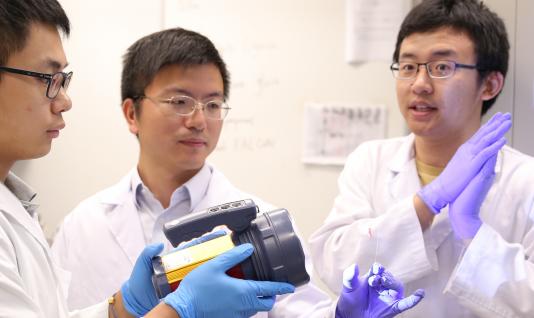  Prof Sun Fei (middle) and his research team
