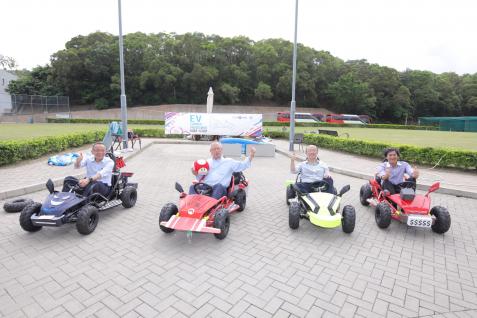  The four judges of the competition take a ride on the cars that the students had built – (from left) Prof Tim Cheng; Prof Roy Chung; Mr Chow Tang Fai; and Prof Ben Chan, Associate Professor of Engineering Education and Associate Director of the Academy for Bright Future Young Engineers.