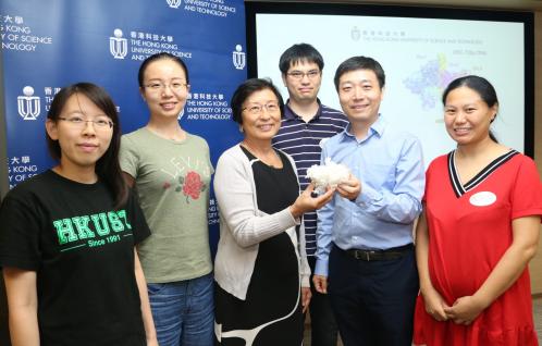  Prof Bik Tye (third left) and Prof Yuanliang Zhai (second right) holding an ORC model with members of the research team