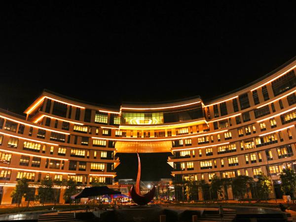 Night view of the HKUST(GZ) Piazza and Administration Building.