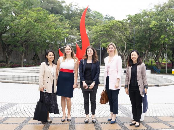 CG Drulhe and her delegation takes a photo in front of the iconic “Red Bird” sculpture at the Piazza.