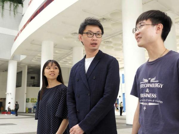 Prof. Leung walking with his students