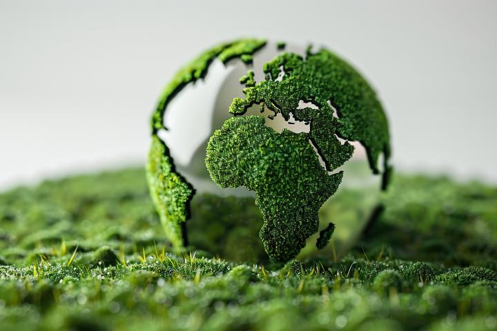 Small, transparent Earth with land made of moss