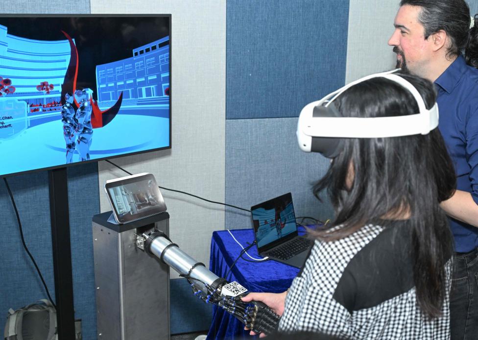This soft-robot-mediated installation by the HKUST XRIM Lab enables a handshake between the Clear Water Bay and Guangzhou campuses, integrating sensing and tactile replication to create a shared touch experience across distance.