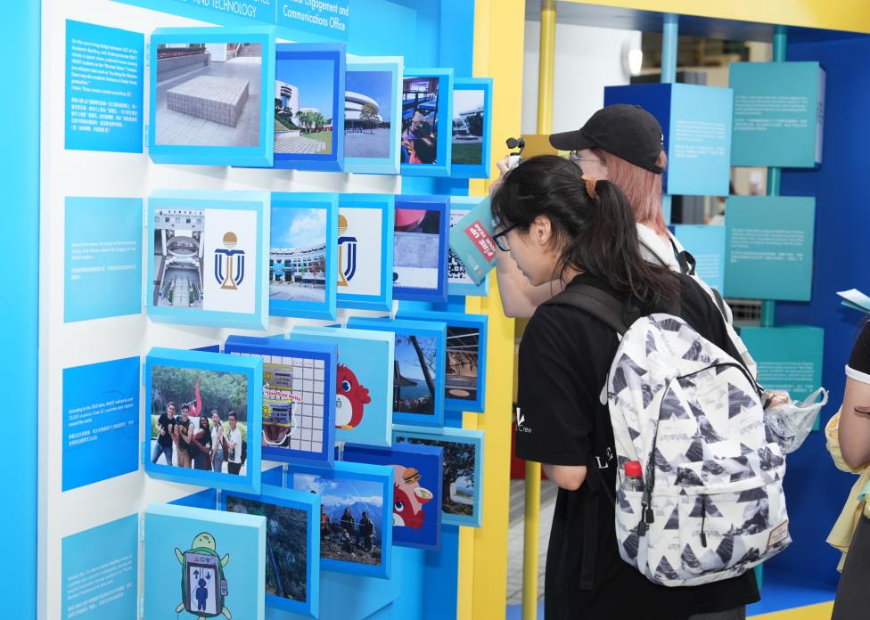 Students gathered at the HKUST Fun Facts Wall, eagerly discovering fascinating stories about the University.