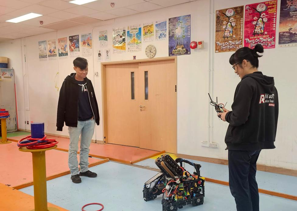 Student engineers pilot their newly minted machine across custom test tracks inside the Dream Team Hub workspace, relentlessly refining their complex algorithmic coordination before match day.